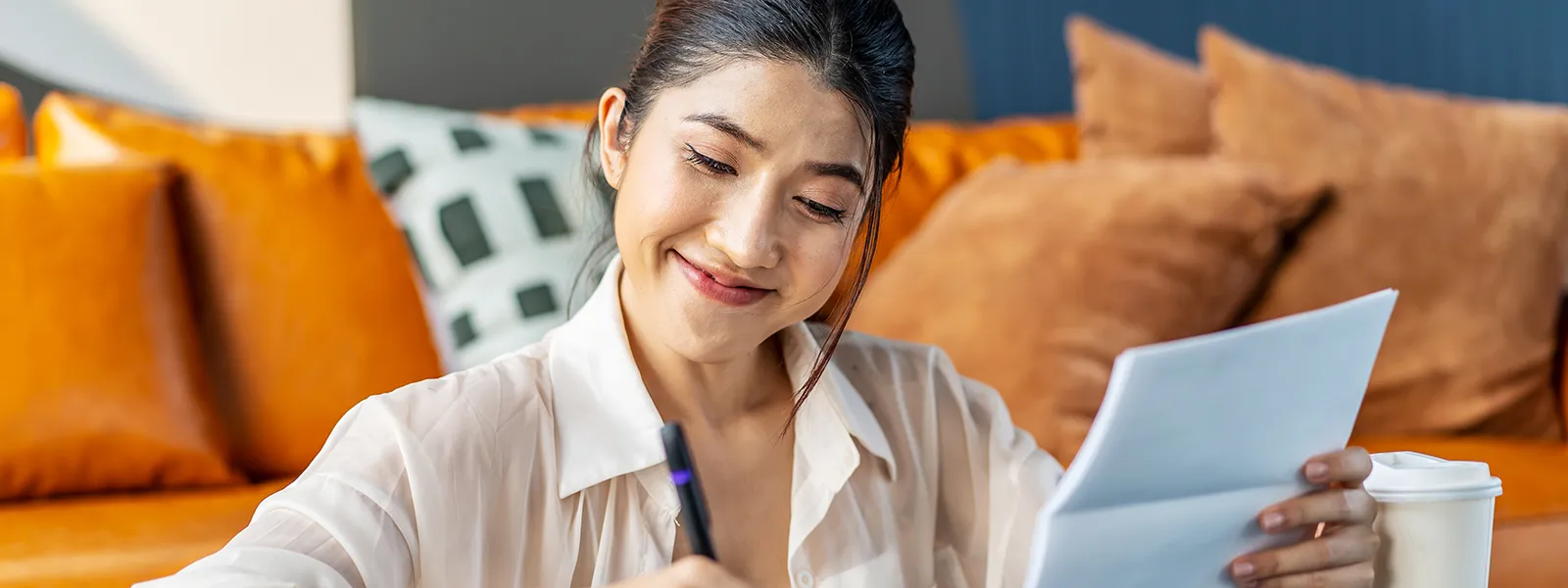 Smiling Woman Taking Notes