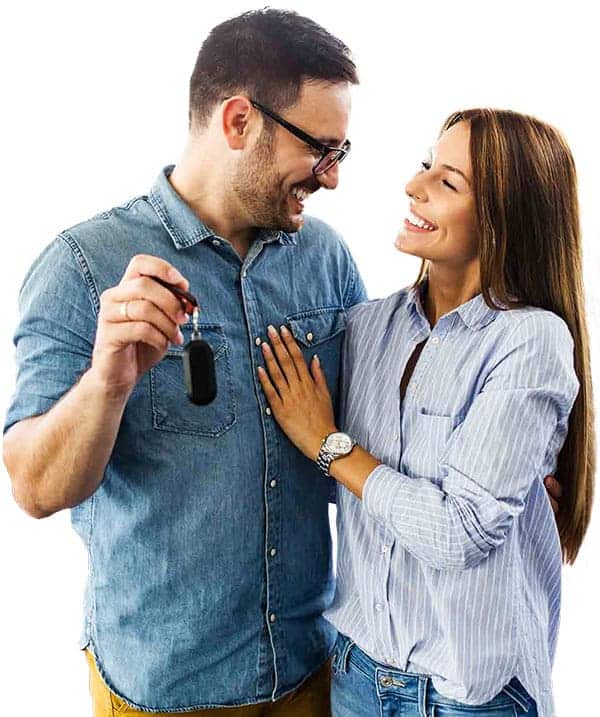 Happy couple holding a set of car keys.