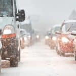 Cars stuck in a traffic jam due to a heavy snowfall.